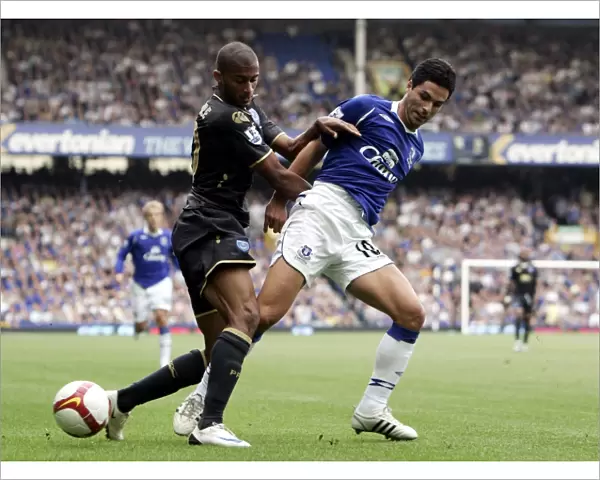 Mikel Arteta vs Armand Traore: Intense Clash in Everton vs Portsmouth Barclays Premier League Match