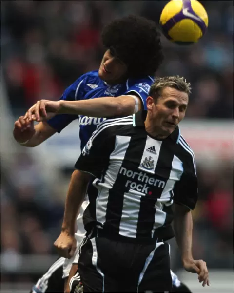 Fellaini vs Lovenkrands: A Battle of Strength and Skill in the 2008-09 Everton vs Newcastle United Barclays Premier League Match