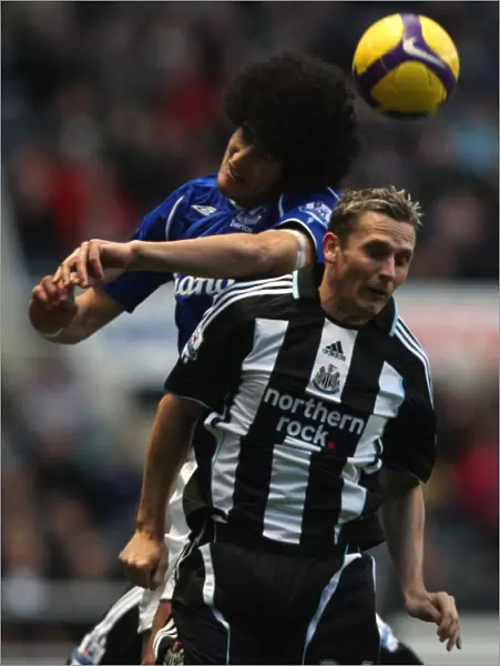 Fellaini vs Lovenkrands: A Battle of Strength and Skill in the 2008-09 Everton vs Newcastle United Barclays Premier League Match