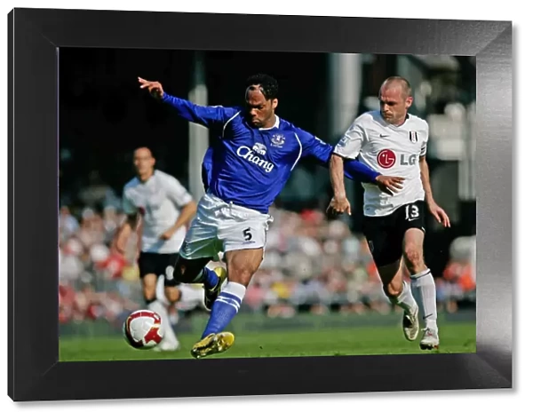 Lecott vs. Murphy: Intense Clash between Everton's Joleon Lescott and Fulham's Danny Murphy in Premier League Showdown (May 2009)