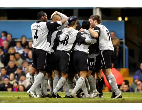 Everton's Glorious Moment: Leon Osman Amidst Team Celebration (Portsmouth vs Everton)