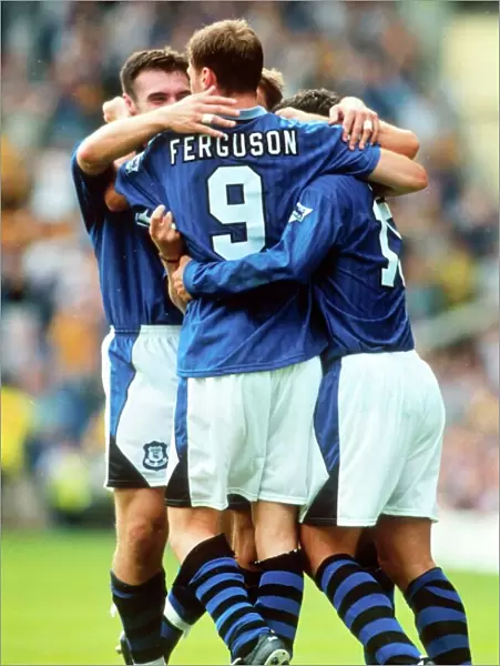 Everton's Duncan Ferguson Celebrates Euphoric Goal with Teammates (1996)