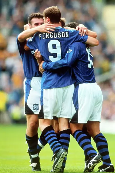 Everton's Duncan Ferguson Celebrates Euphoric Goal with Teammates (1996)