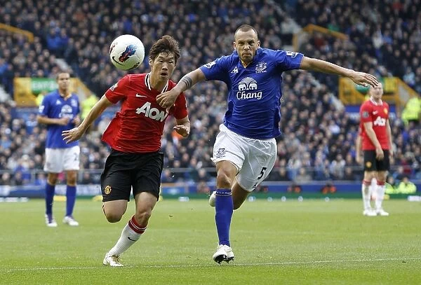 Battle for the Ball: Heitinga vs. Park - Everton vs. Manchester United Clash (BPL 2011)