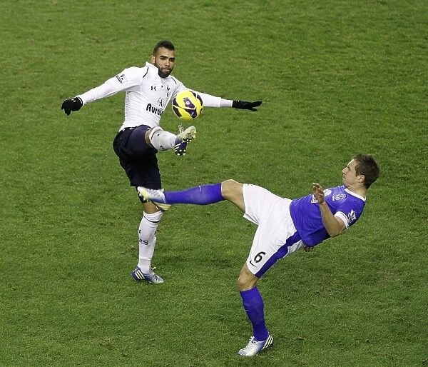 Battle for the Ball: Jagielka vs. Sandro - Everton vs. Tottenham's Intense Rivalry (Everton 2-1)