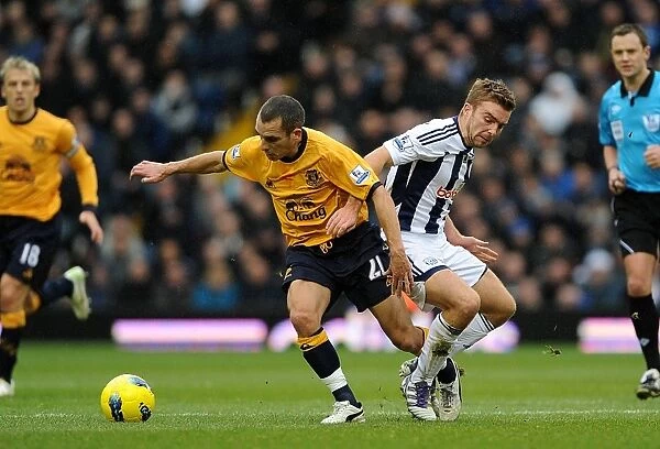 Battle for the Ball: Morrison vs Osman - Premier League Clash between West Bromwich Albion and Everton (01 January 2012)