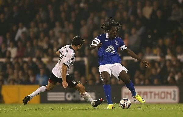 Battling for Control: Lukaku vs. Karagounis in the Capital One Cup Showdown at Craven Cottage