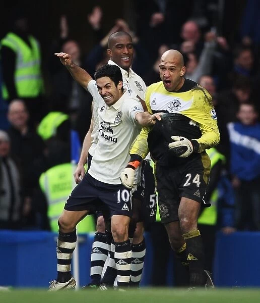 Celebrating FA Cup Glory: Tim Howard and Mikel Arteta's Triumphant Moment after Everton's Victory over Chelsea (February 19, 2011)
