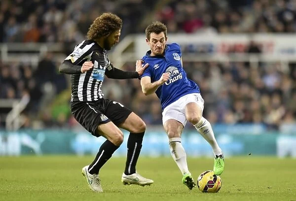 Coloccini vs. Baines: Intense Clash Between Newcastle's Fabricio Coloccini and Everton's Leighton Baines in Premier League Encounter