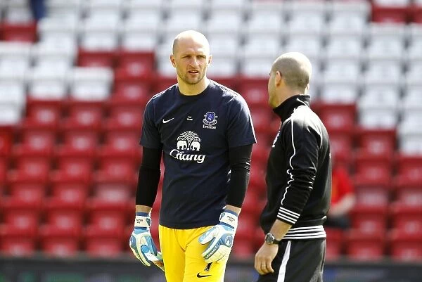 Deep in Thought: Tim Howard Engages Everton Teammate Amidst Scoreless Liverpool Rivalry (Barclays Premier League, Anfield - May 5, 2013)