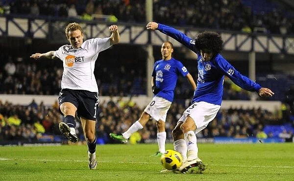 Determined Duel: Fellaini's Brave Shot Against Bolton Wanderers in Everton's Premier League Clash (10 November 2010)