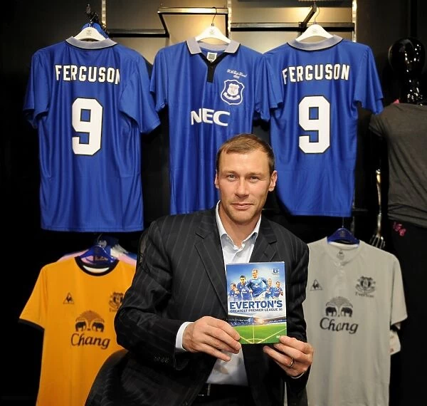 Duncan Ferguson poses with a copy of Evertons Greatest Premier League XI DVD in the Everton Two Store at Liverpool One