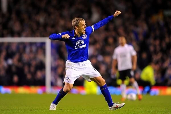 Euphoria at Goodison: Phil Neville's Triumphant Moment as Everton Defeats Tottenham Hotspur in the Barclays Premier League (10 March 2012)