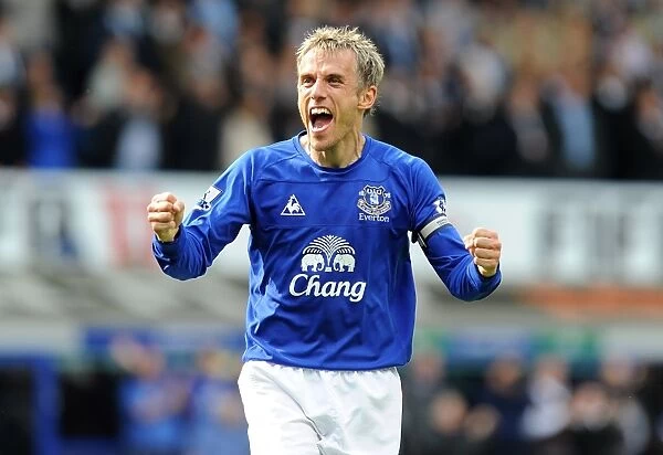 Euphoria Unleashed: Phil Neville's Triumphant Moment as Everton Defeats Manchester City in the Barclays Premier League (07 May 2011)