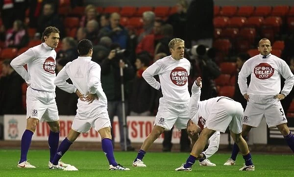 Everton Players Prepare for Battle: Jelavic, Stracqualursi, Neville, Osman, Heitinga Stretch Before Anfield Clash (13 March 2012)