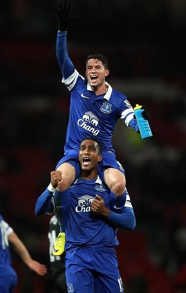 Everton's Bryan Oviedo and Sylvain Distin: Celebrating a Historic 1-0 Victory Over Manchester United at Old Trafford (December 2013)