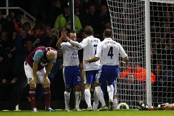 Everton's Double Delight: Celebrating the Second Goal Against West Ham United in the Barclays Premier League (December 22, 2012, Upton Park)