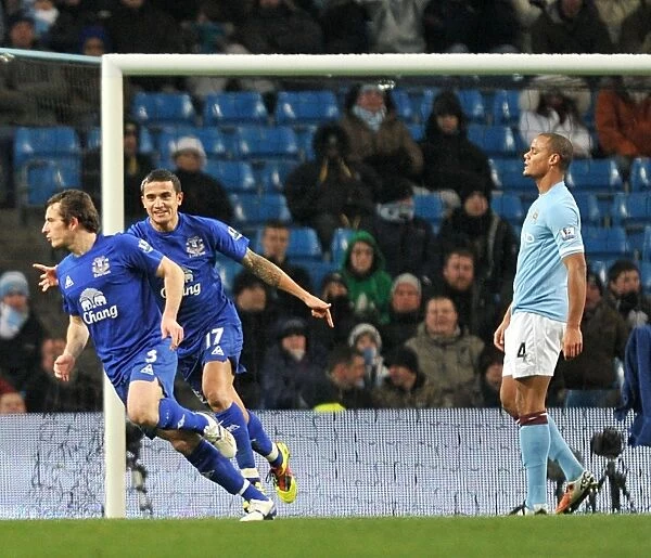 Everton's Double Delight: Leighton Baines and Tim Cahill Celebrate Second Goal vs. Manchester City (December 2010)