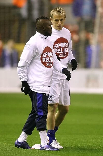 Everton's Drenthe and Neville: A Pre-Match Chat at Anfield