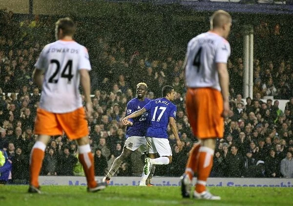 Everton's Louis Saha in Triumphant Celebration After Scoring the Third Goal Against Blackpool (05 February 2011)