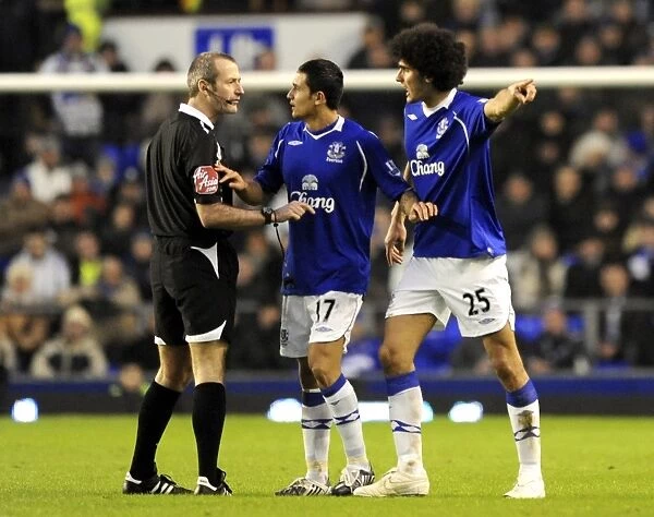 Everton's Tim Cahill and Marouane Fellaini Go Head-to-Head Against Hull City and Referee Martin Atkinson in the Barclays Premier League, 2009