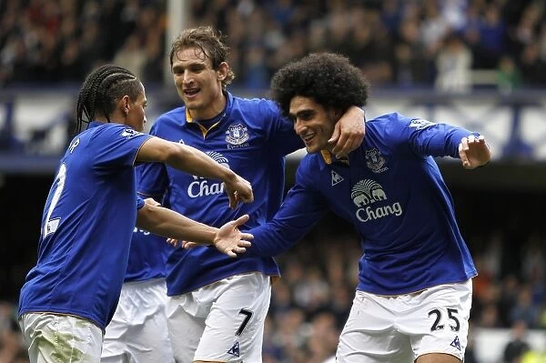 Everton's Triumph: Fellaini, Jelavic, and Pienaar Celebrate Second Goal vs. Fulham (April 2012)