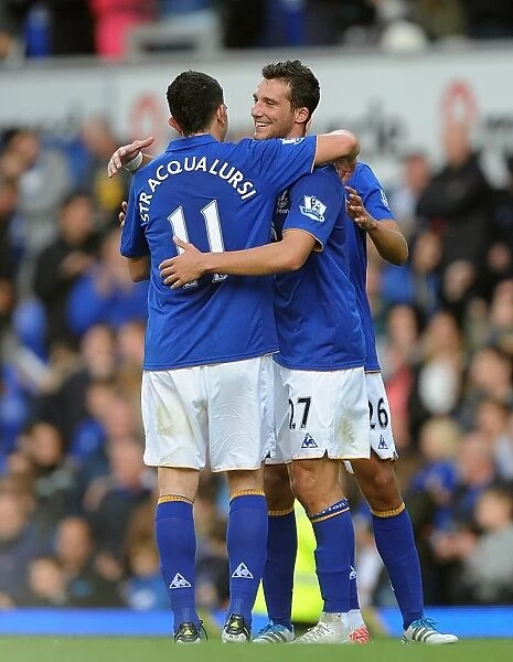 Everton's Victory Celebration: Vellios and Stracqualursi Rejoice at Goodison Park