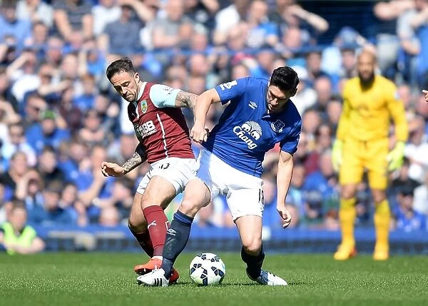 Intense Rivalry: Barry vs. Ings Battle for Ball at Goodison Park