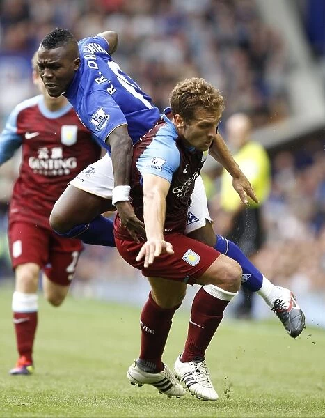 Intense Rivalry: Drenthe vs. Petrov Battle at Goodison Park - Everton vs. Aston Villa, Barclays Premier League (2011)