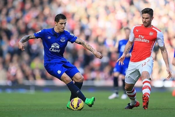 Intense Rivalry on the Pitch: Giroud vs Besic - Arsenal vs Everton, Premier League Showdown