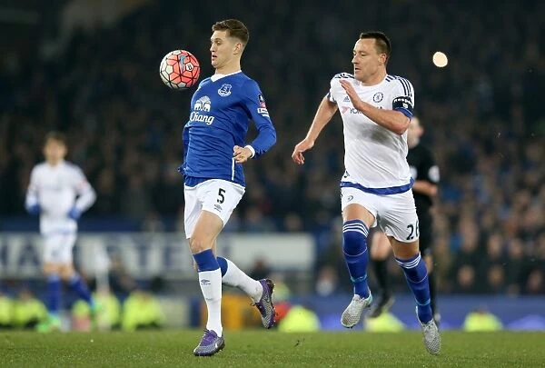 John Terry vs. John Stones: A Battle for the Ball in the Emirates FA Cup Quarterfinal at Goodison Park