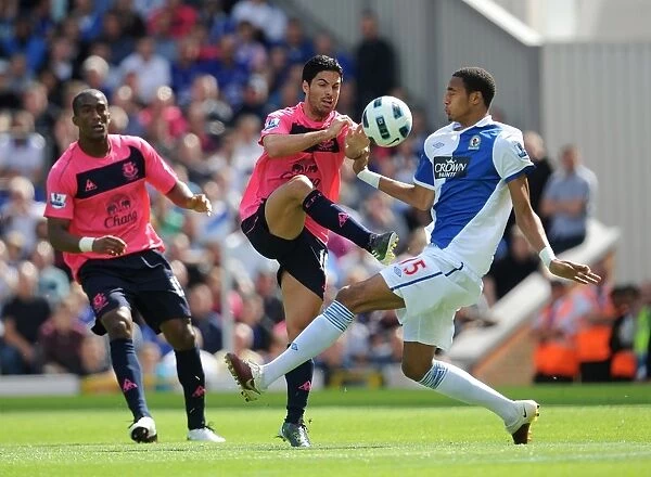 Mikel Arteta vs. Steven Nzonzi: A Footballing Battle at Blackburn Rovers vs. Everton, Barclays Premier League