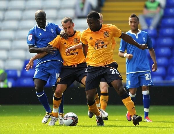 Morgaro Gomis vs. Osman and Yakubi: Intense Battle for the Ball in Birmingham City vs. Everton Pre-Season Friendly (July 2011)