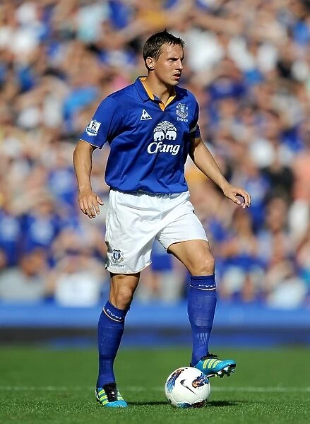 Phil Jagielka vs. Liverpool: Everton's Defender Faces Off in the Intense Everton vs. Liverpool Barclays Premier League Match at Goodison Park (1 October 2011)
