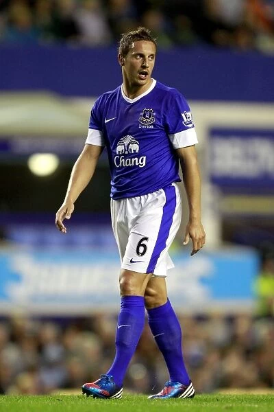 Phil Jagielka's Triumphant Celebration: Everton's 5-0 Capital One Cup Victory over Leyton Orient (2012)