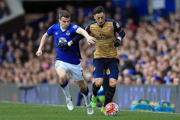 Seamus Coleman vs. Mesut Ozil: A Battle for the Ball at Goodison Park - Everton vs. Arsenal, Barclays Premier League