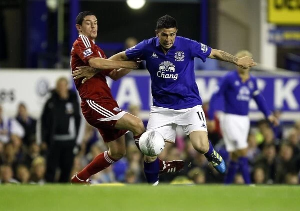 Stracqualursi vs Dorrans: A Battle for Ball Supremacy in Everton's Carling Cup Clash against West Bromwich Albion