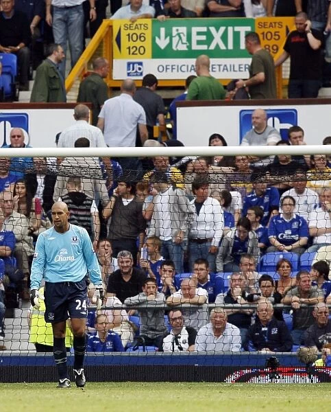 Tim Howard's Disappointment: Everton's Goalkeeper After Conceding Three Goals vs. Portsmouth (BPL 2008)