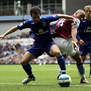 Agbonlahor vs. Baines: Intense Action from Aston Villa vs. Everton (2007) Football Match