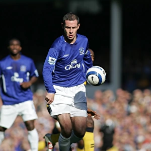 David Weir: Guarding Everton's Turf - Shielding the Ball from Wigan's Advance