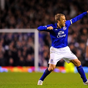 Euphoria at Goodison: Phil Neville's Triumphant Moment as Everton Defeats Tottenham Hotspur in the Barclays Premier League (10 March 2012)