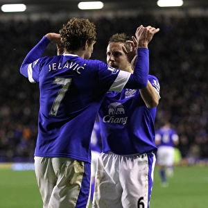 Everton's Jelavic and Jagielka: A Celebratory Moment as Everton Takes a 2-1 Lead Over Tottenham (December 9, 2012, Goodison Park)