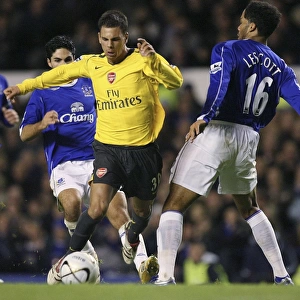 Evertons Lescott challenges Arsenals Aliadiere for the ball during their English League Cup fourth