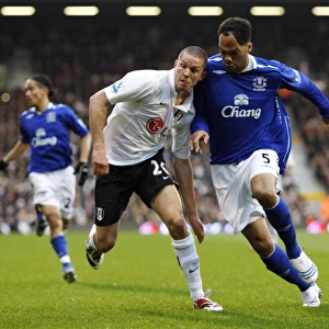 Football - Fulham v Everton Barclays Premier League - Craven Cottage - 16 / 3 / 08 Evertons Joleon Lescott and Fulhams Leon Andreasen Mandatory Credit: Action Images / John Sibley Livepic NO ONLINE / INTERNET USE WITHOUT A LICENCE FROM THE FOOTBA