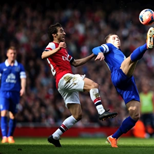 Intense Battle for Possession: Flamini vs. Barkley in FA Cup Sixth Round Clash between Arsenal and Everton