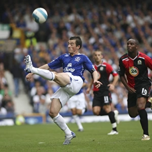 Leighton Baines vs Benni McCarthy: A Premier League Battle at Goodison Park, Everton vs Blackburn Rovers (07/08)