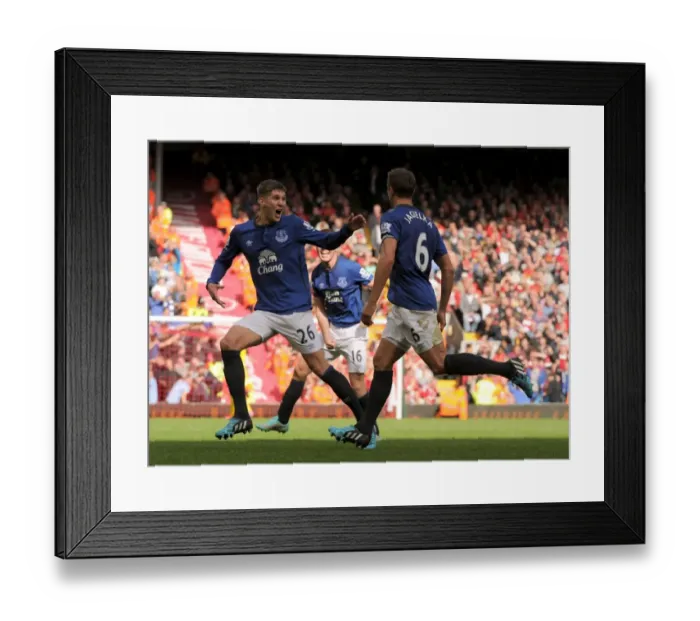 Framed Print : Everton's Unstoppable Duo: Jagielka and Stones Celebrate Historic Goal vs. Liverpool (BPL)