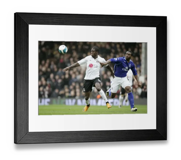 Framed Print : Football - Fulham v Everton Barclays Premier League - Craven Cottage - 16  /  3  /  08 Fulhams Eddie Johnson and Evertons Joseph Yobo Mandatory Credit: Action Images  /  John Sibley Livepic NO ONLINE  /  INTERNET USE WITHOUT A LICENCE FROM THE FOOTBALL D
