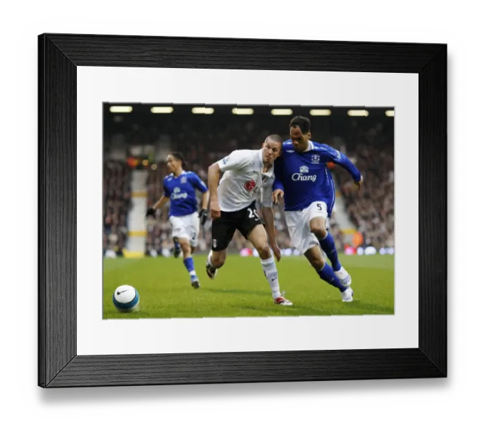 Framed Print : Football - Fulham v Everton Barclays Premier League - Craven Cottage - 16  /  3  /  08 Evertons Joleon Lescott and Fulhams Leon Andreasen Mandatory Credit: Action Images  /  John Sibley Livepic NO ONLINE  /  INTERNET USE WITHOUT A LICENCE FROM THE FOOTBA