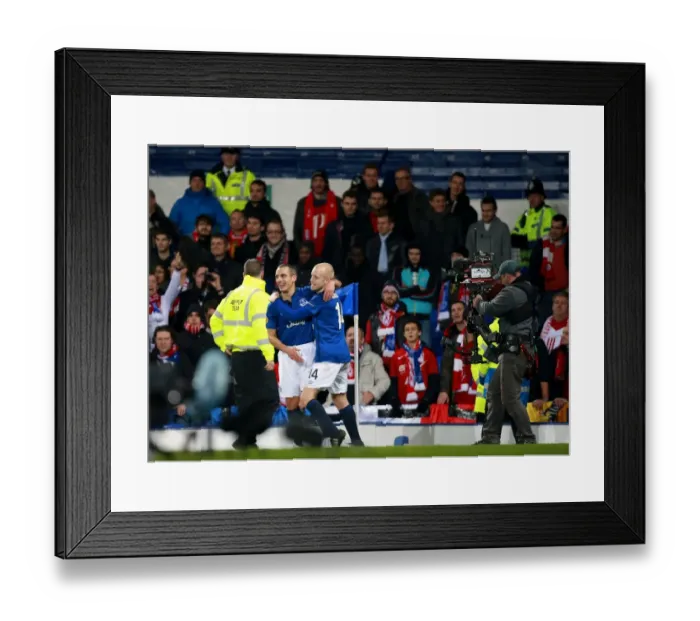 Framed Print : Everton's Leon Osman Scores First Goal in Europa League Clash Against Lille Framed Print : Everton's Leon Osman Scores First Goal in Europa League Clash Against Lille